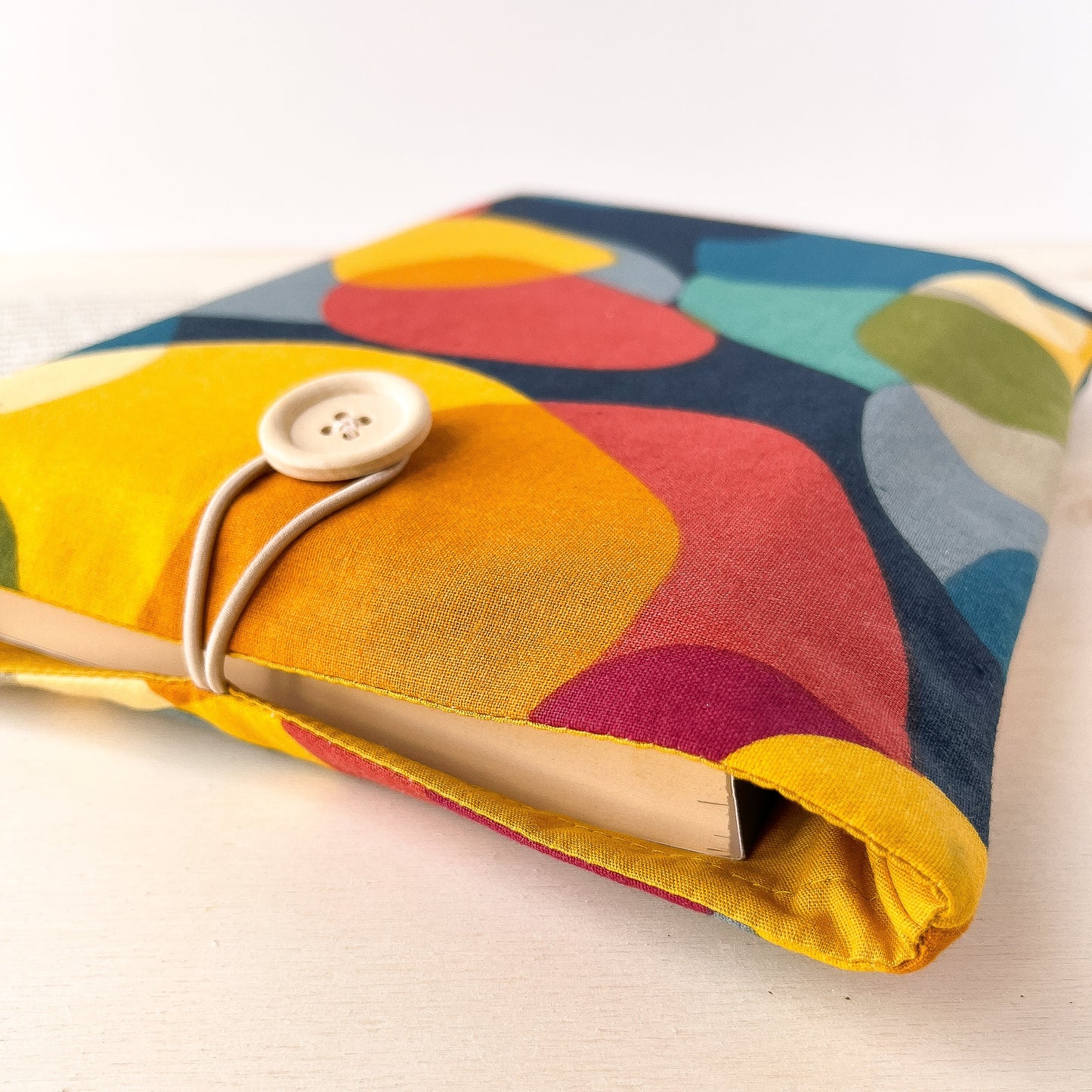 Colorful padded book sleeve