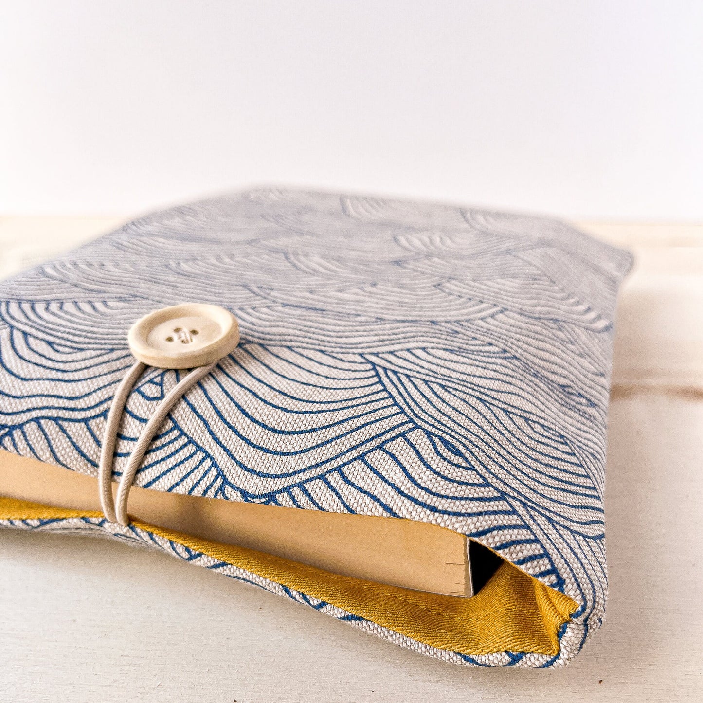 Custodia per libri imbottita in cotone con motivo a onde blu