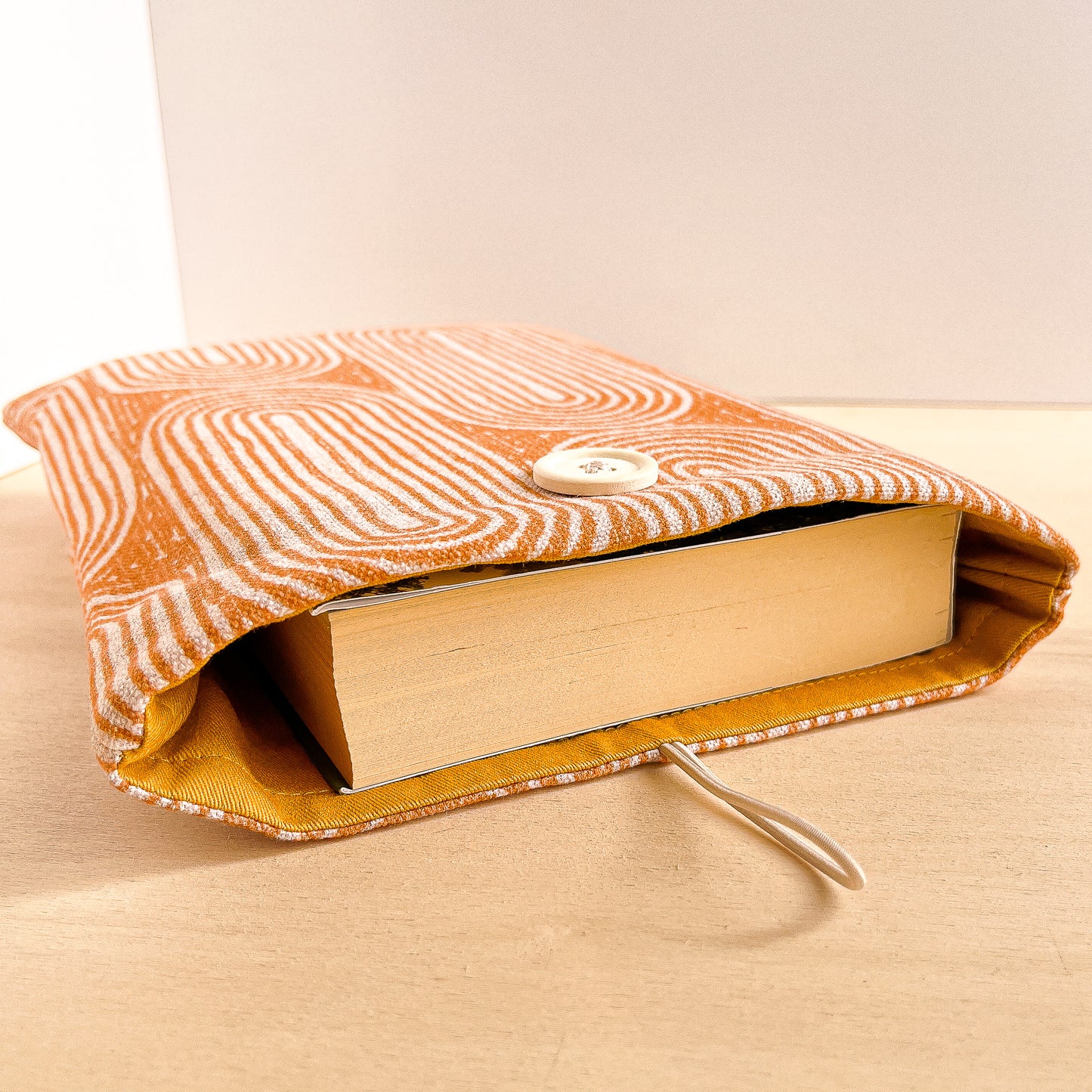 Custodia per libri imbottita in cotone con motivo geometrico arancio