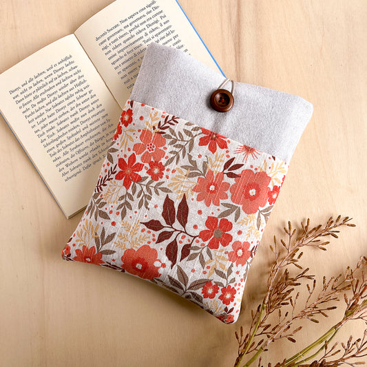Custodia per libri imbottita con tasca a motivo a fiori arancio