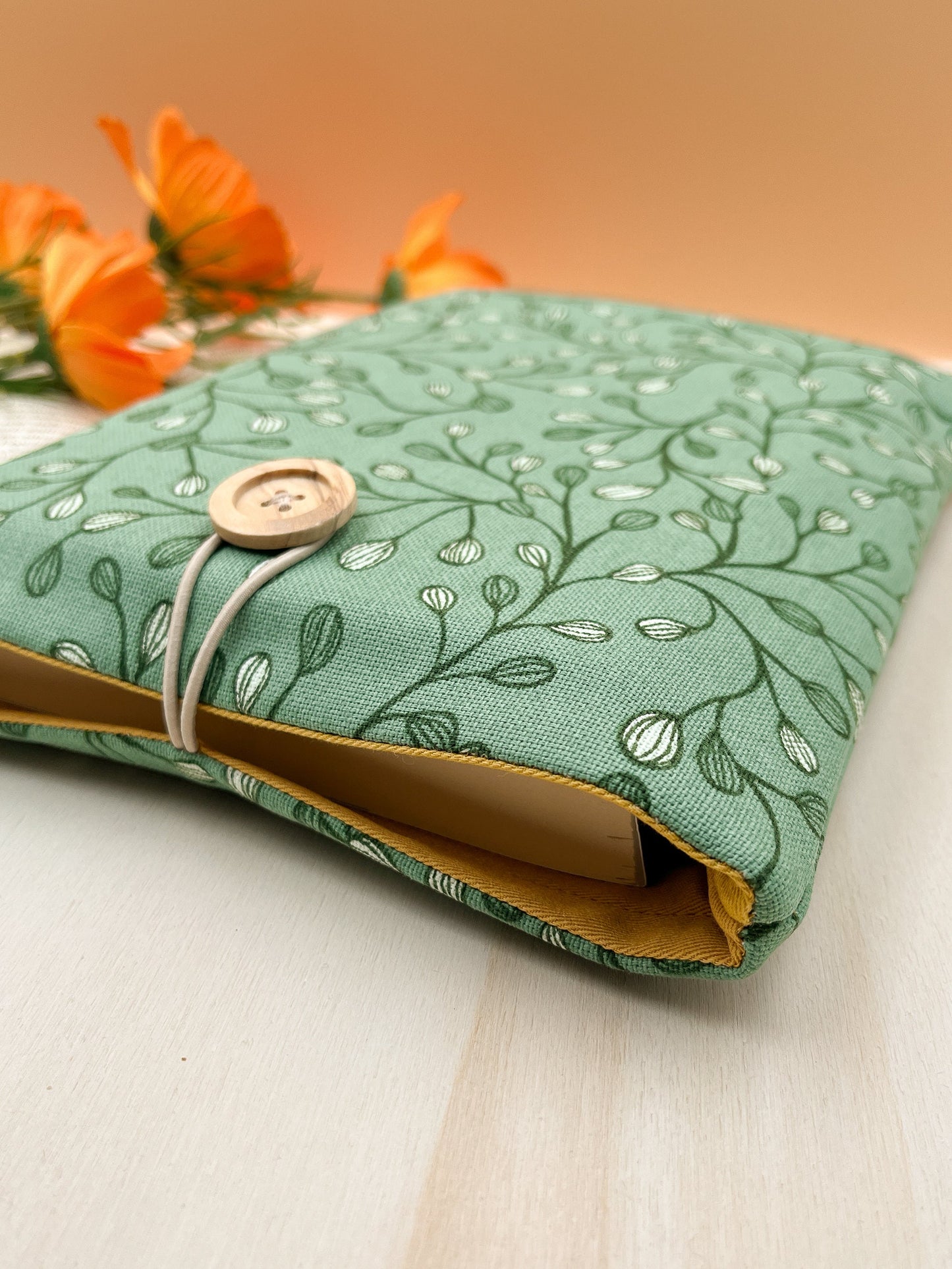 Custodia per libri imbottita in cotone verde con motivo a foglie